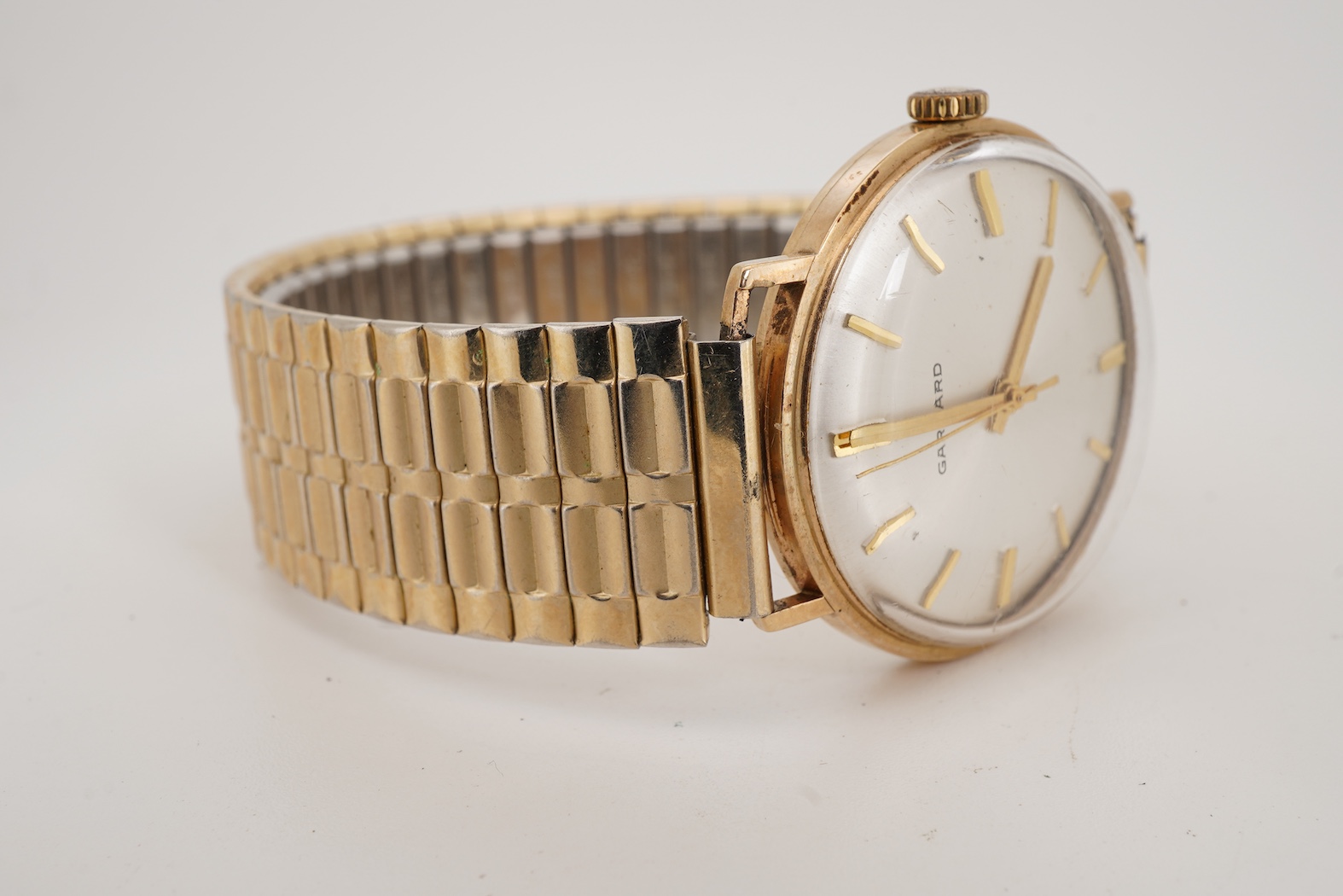 A gentleman's 1970's gold manual wind wrist watch, retailed by Garrard